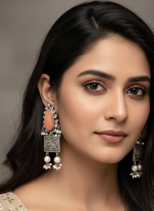 Traditional oxidized earring embellished with stones and pearls